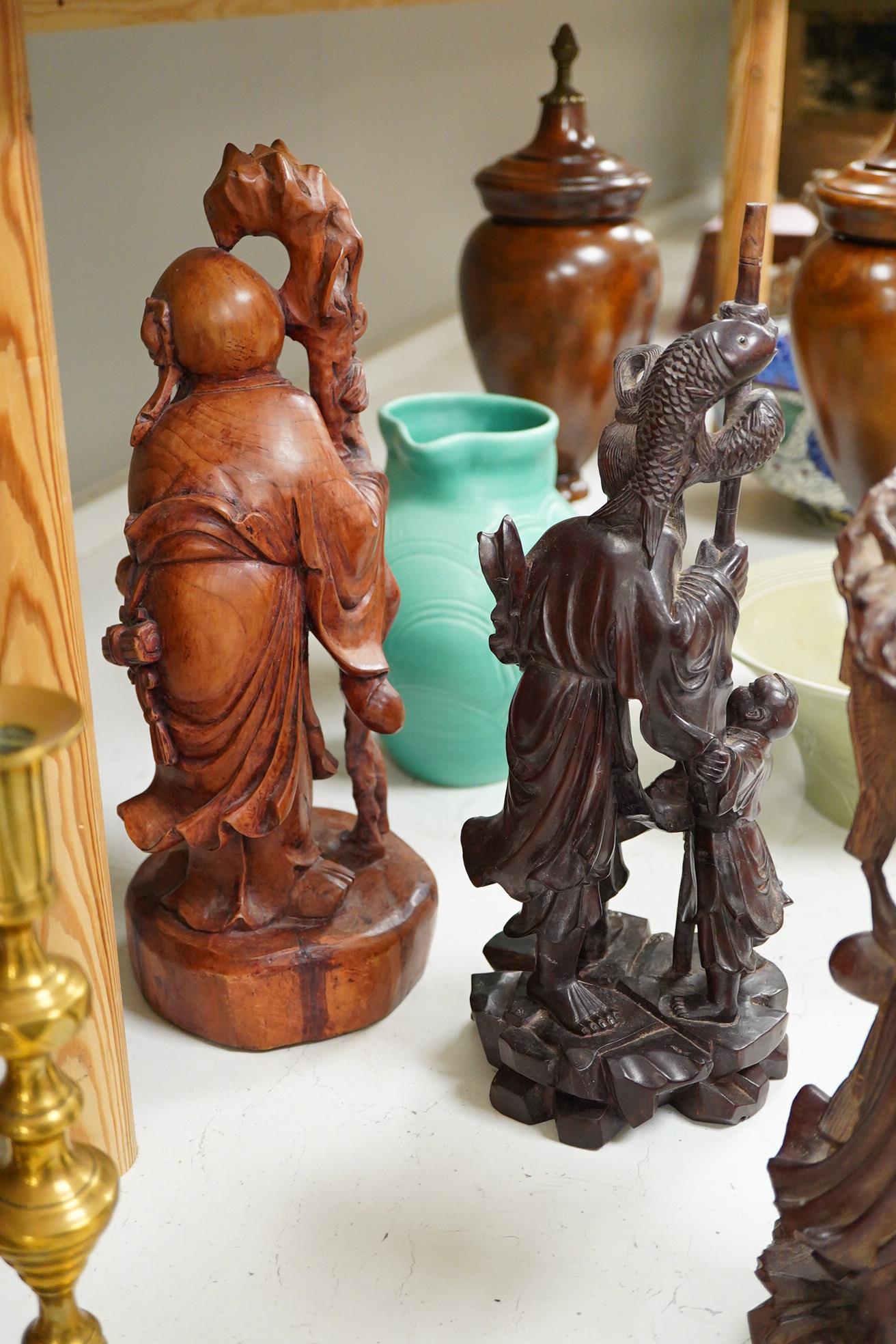 Three Chinese carved wood figures; Shou Lao, a fisherman and a Luohan, tallest 39cm